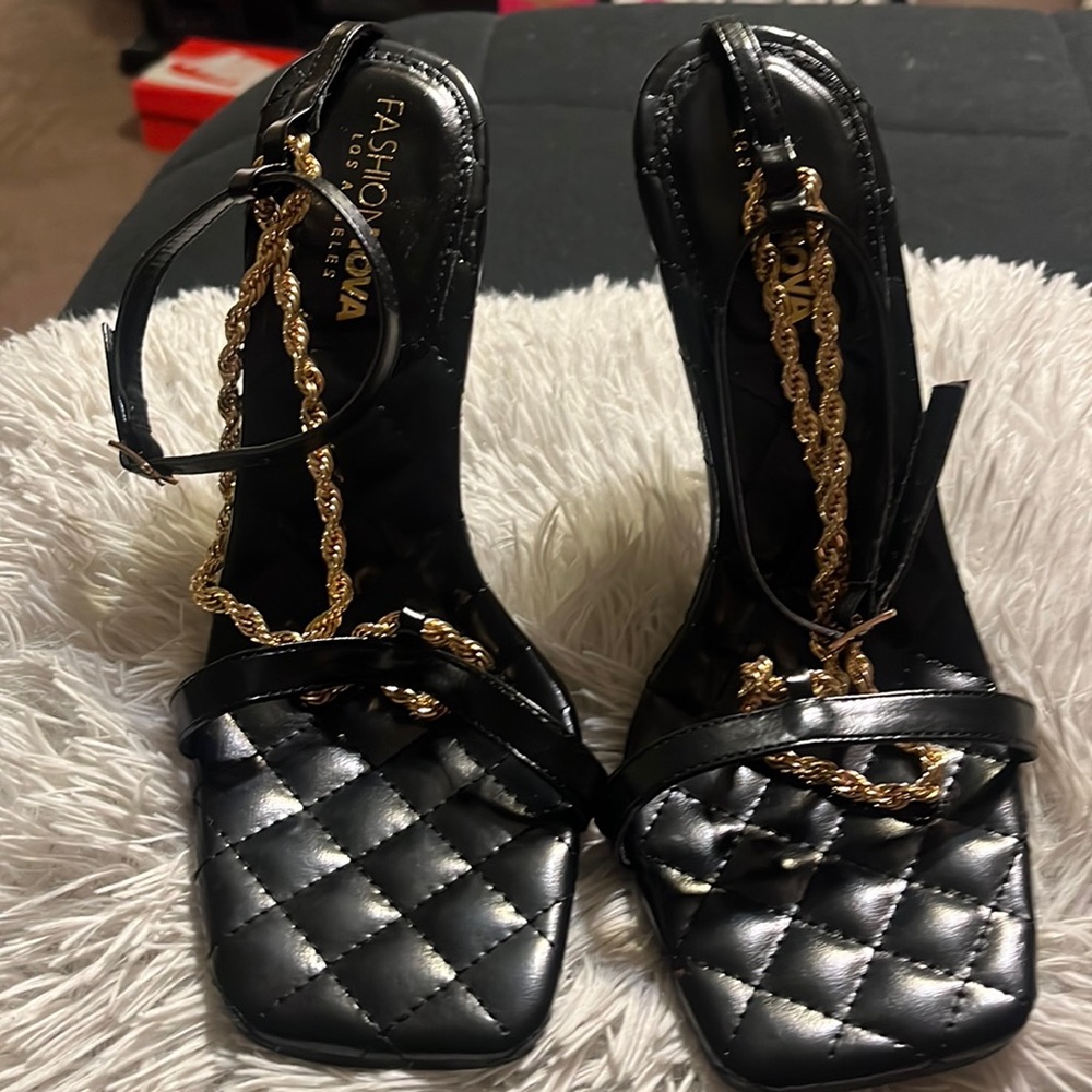 Size 8 low heels black with gold chain strap .